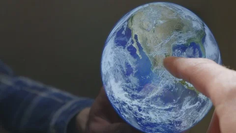 A man pointing at the earth on a screen Video stock 102953382