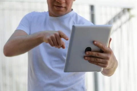 Man pointing a finger at a square digital frame Stock Photos