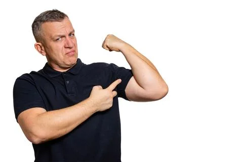 Man pointing at flexed arm strength concept Stock Photos