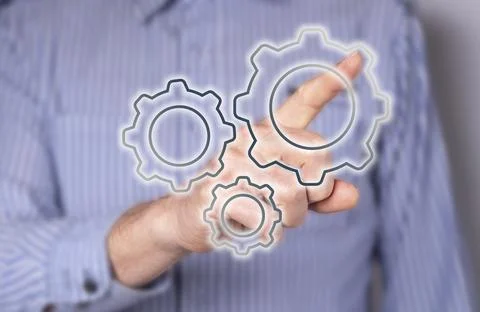 Man pointing to gear at virtual screen. Strategy, process organization, busin Stock Photos