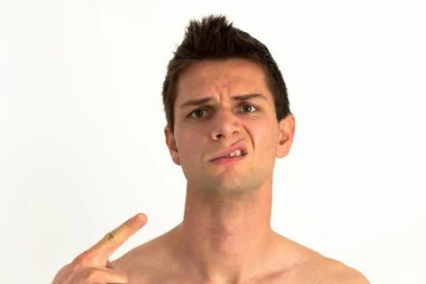 Man pointing at himself and making a weird expression Stock Photos