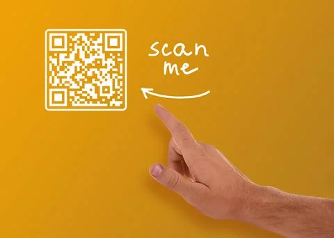 Man pointing at illustration of QR code on orange background, closeup Stock Photos