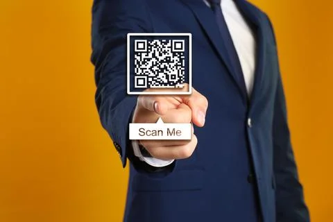 Man pointing at illustration of QR code on orange background, closeup Stock Photos