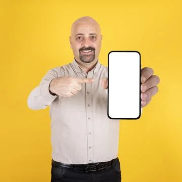 Man pointing mobile phone empty screen, recommending application concept. Stock Photos