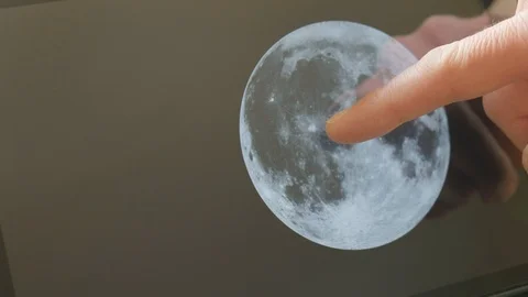 A man pointing at the moon on a screen Video stock 102921809