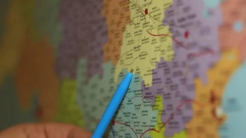 Man is Pointing by the Pen on the Map Stock Footage 70505250