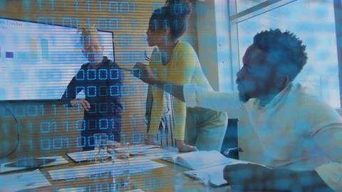 Man pointing at sales chart, team leaning in analyzing binary code overlay Video stock 318260396