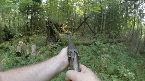 A man pointing a shot gun on the woods Stock Footage 241077754