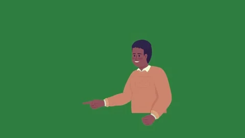 A man pointing at something on green screen and in an orange shirt the camera Video stock 335130040