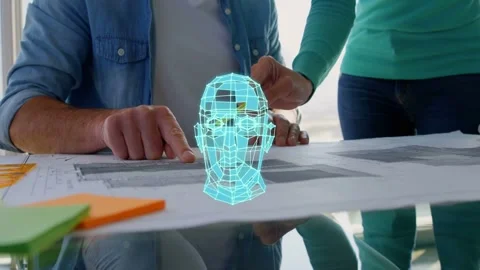 Man pointing, starting cyan 3D head rotating above plans, woman tracing pencil Stock Footage 333368403