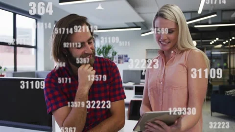 Man pointing at tablet and partner tapping screen checking IT data as numeric Video stock 328417274