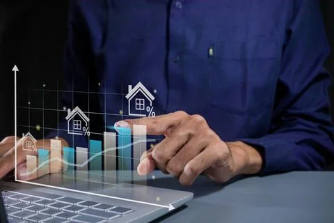Man pointing to a virtual graph. House price rising up or real estate prope.. Stock Photos