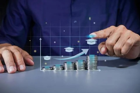 Man pointing to virtual screen of increasing education cost. Stack of coins.. Stock Photos