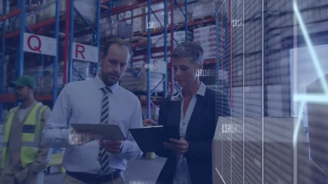 Man pointing, woman tapping tablet doing logistics check in warehouse overlay Stock Footage 334788807