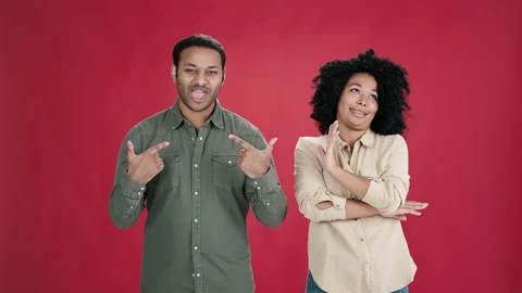 Man points to himself arrogantly and wom... Stock Video Pond5