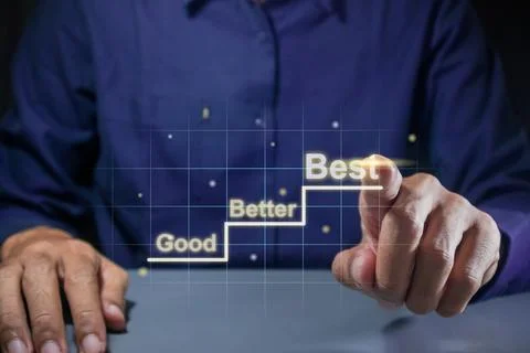 Man points to a virtual screen of steps from good to better to best. Contin.. Stock Photos