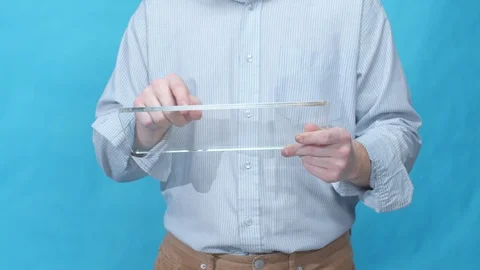 A man pokes the screen of a glass tablet Stock Footage 129978199