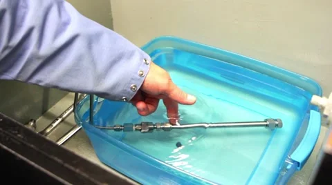 Man pokes underwater pipe Stock Footage 66766980