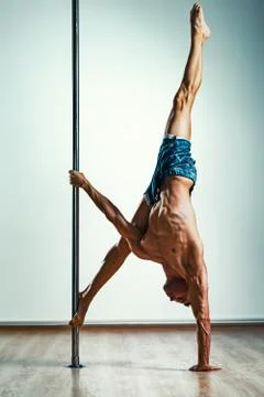 Man pole dancing Stock Photos