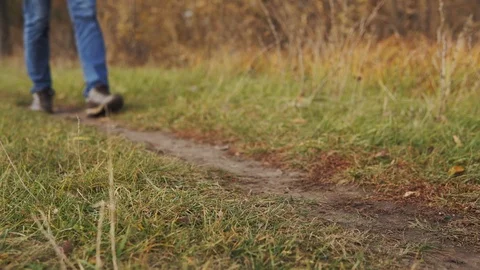 Man pollution nature concept. A close-up shot of an irresponsible man in jeans Stock Footage 120872553