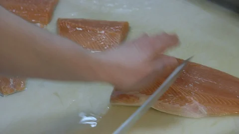 Man portioning salmon fillets Stock Footage 104867902
