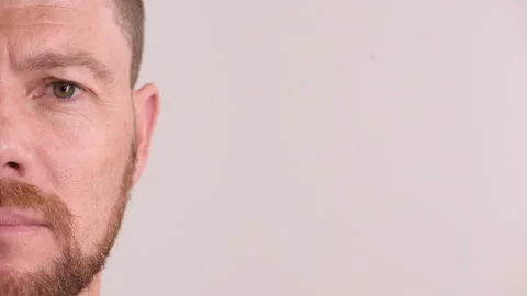 Man, portrait and studio with face for sight, optometry or awareness on a white Video stock 334708650