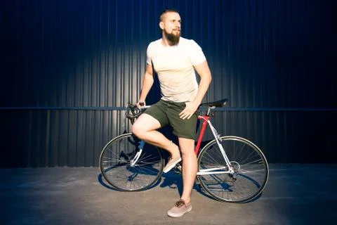 Man posing with bicycle Stock Photos