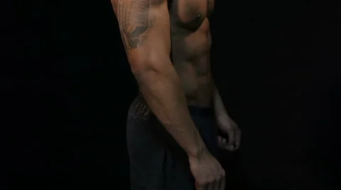 Man posing on a black background 스톡 동영상 56753864