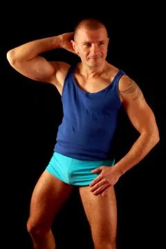 Man is posing on black background Stock Photos