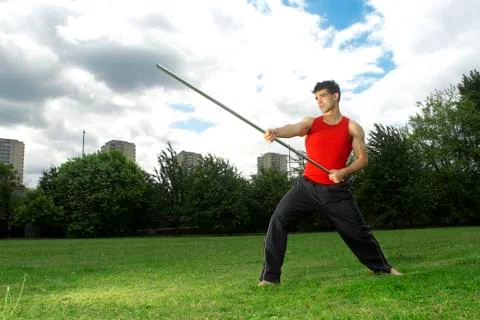 Man posing with bow staff Stock Photos