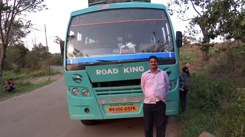 A man is posing in front of a bus in north-east hilly India, Manipur Stock Footage 38116878
