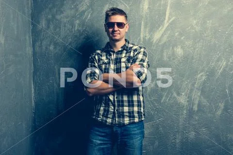 Man posing with his arms folded Stock Photos