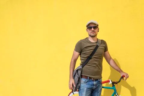 Man posing with his fixed gear bicycle Stock Photos
