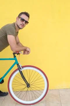 Man posing with his fixed gear bicycle Stock Photos
