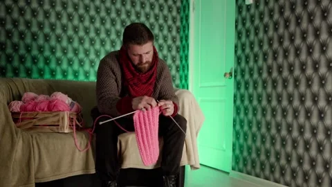 Man posing with knitting Stock Footage 171745052
