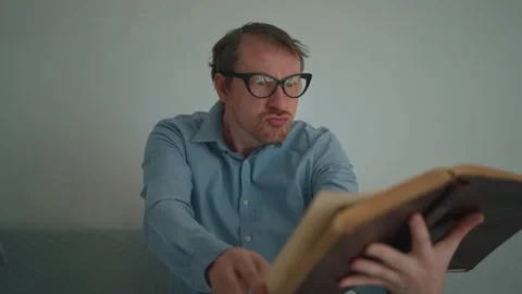 Man posing with paper book Stock Footage 240226901