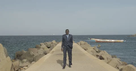 Man posing for a picture, Goree, Senegal (4K) Stock Footage 47943448