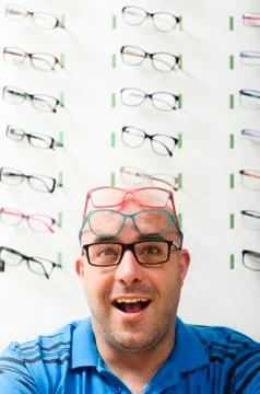 Man posing smiling in glasses background Stock Photos