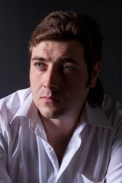 Man posing in white shirt Stock Photos