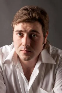 Man posing in white shirt Stock Photos