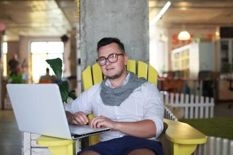 Man posing on workplace in startup office Stock Photos