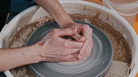 A man potter slowly forming basic piece of clay 스톡 동영상 124430573