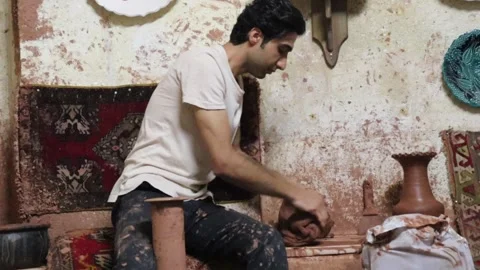 Man Potter technique in making clay pots. Turkish clay shop Video stock 245267926