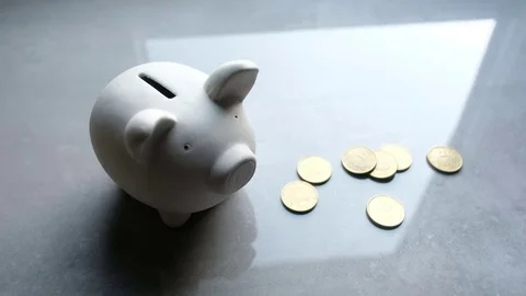 Man poured coins Stockbeeldmateriaal 82307744