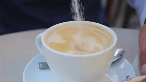 The man poured sugar in coffee Stock Footage 72670761
