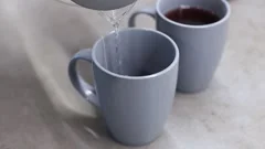 https://images.pond5.com/man-pouring-boiling-water-kettle-footage-152045731_iconm.jpeg