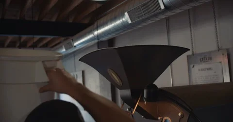 Man Pouring Coffee Beans Into Machine 스톡 동영상 105367302