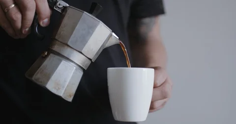 Man pouring coffee into cup Stock Footage 94629049