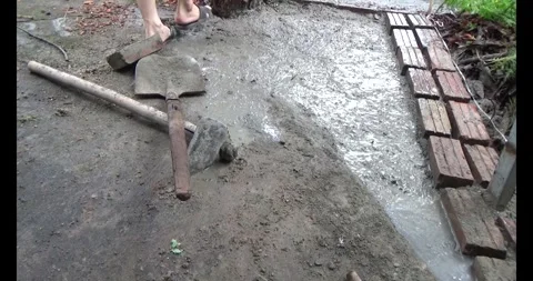 Man pouring concrete yard Stock Footage 312199598