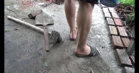 Man pouring concrete yard Stock Footage 312199846